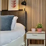 Acogedor En *